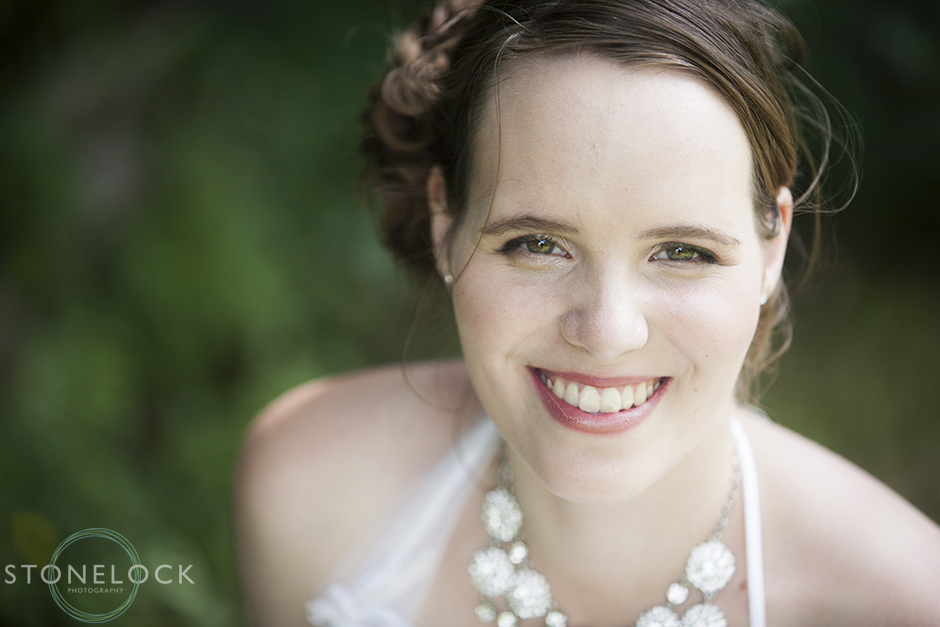 A portrait of a bride as she gazes directly at the camera