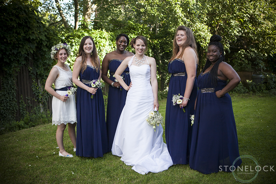 The bride and bridesmaids pose with attitude