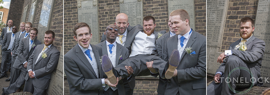 The best man, ushers and groomsmen pick up and carry the groom
