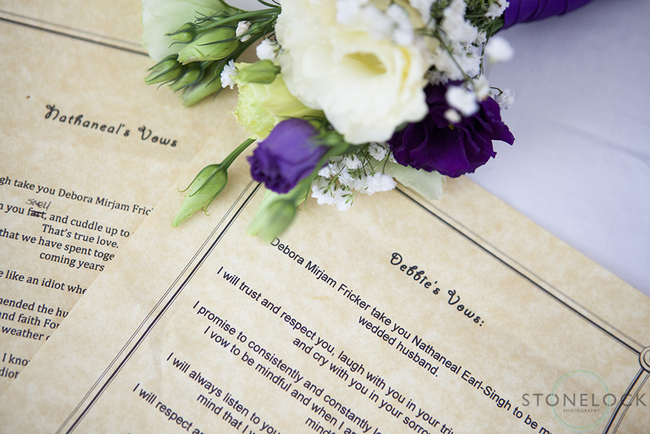 A photo of the bride and groom's wedding vows with the flowers