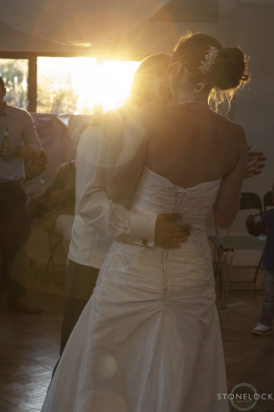 The first dance as the sun sets outside the window