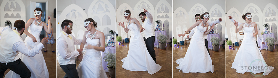 The bride and groom do their first dance wearing masks