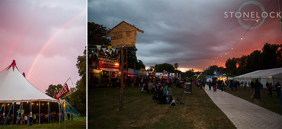 The sun sets on the Treehouse venue at Greenbelt Arts Festival at Boughton House whilst a rainbow sits behind the Big Top