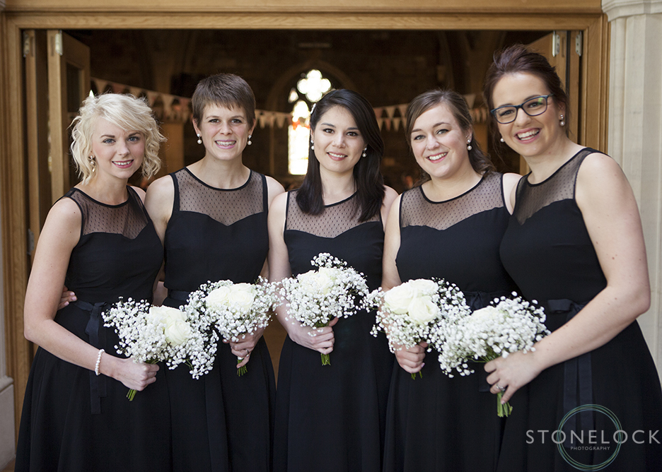 A photograph of the bridesmaids as they wait for the bride to arrive at the Church for the wedding ceremony