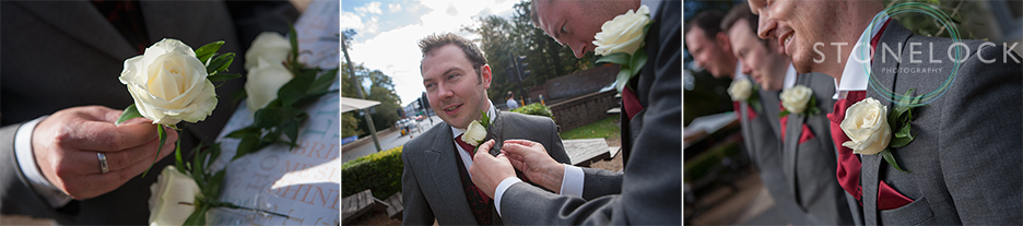 The ushers pin on their button holes before the wedding ceremony