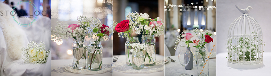 Flowers in jars sit on tables to decorate the wedding reception at St Mary Magdelene Church