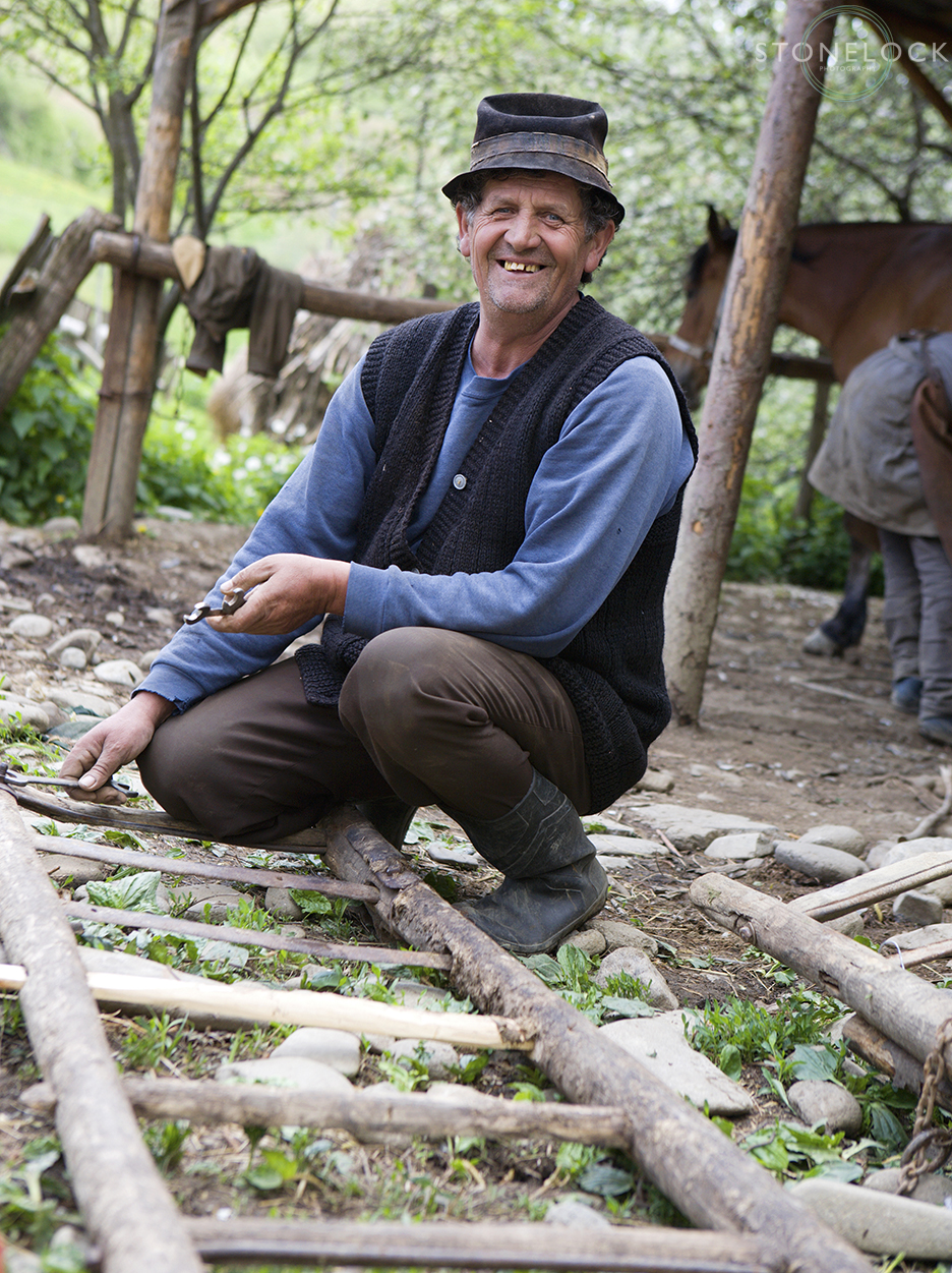 A worker at Ioan Bizau's blacksmiths, Bogdan Voda, Maramures, Romania,