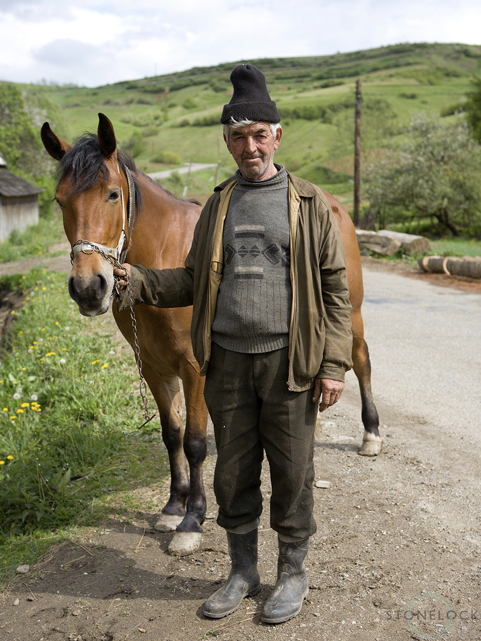 A man brings his horse to the blacksmith in Bogdan Voda, Maramures, Romania, 