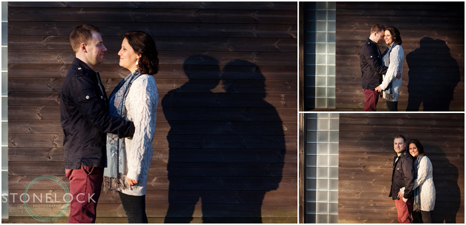 Engagement shoot in Finsbury Park North London, the couple stand in front of a wooden building