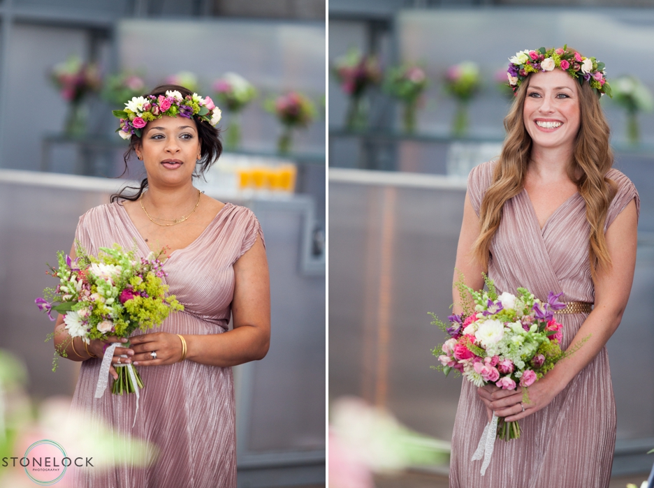 Bridesmaids walk down the aisle at a wedding on The Deck at the National Theatre