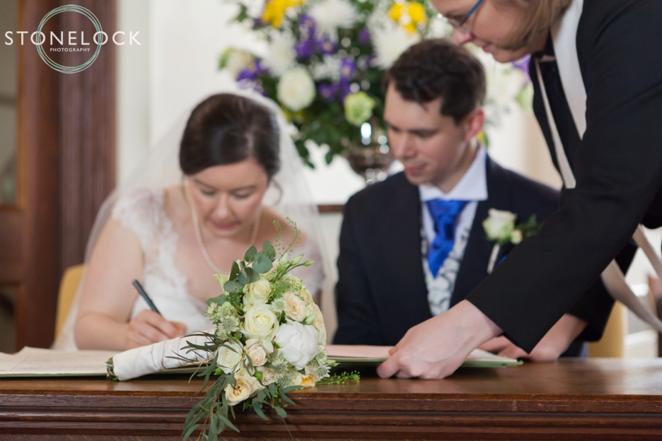 Signing the register at Barnes Methodist Church wedding photography, London