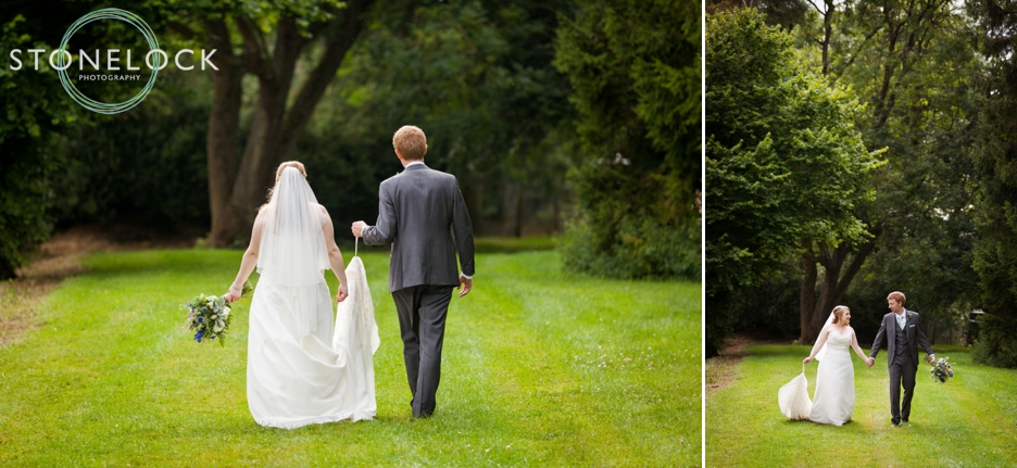 Bride and groom walking at Bassmead Manor Barns in Cambridgeshire for their wedding photography