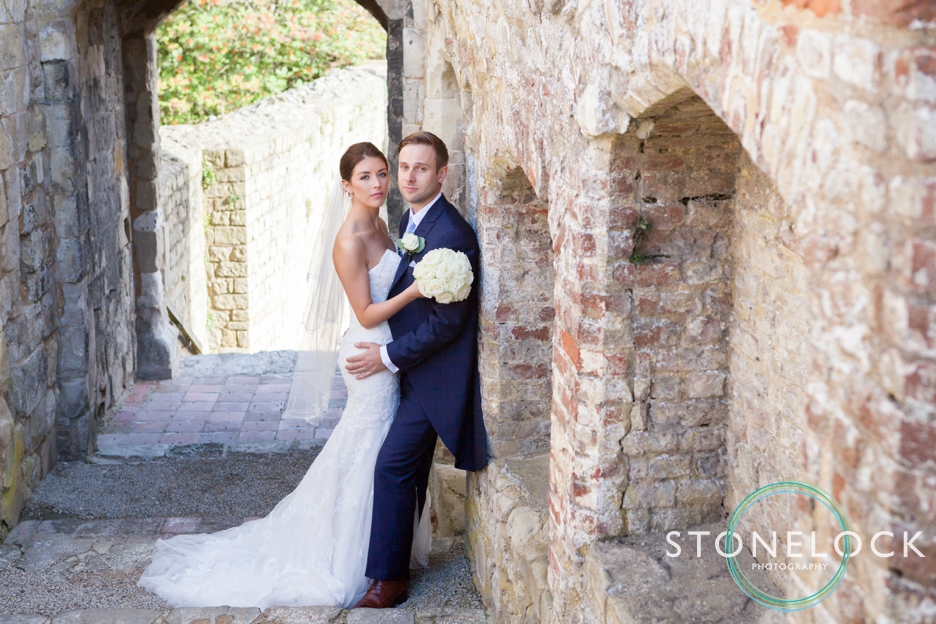 Top tips for great wedding photography, bride & groom pose at Farnham castle