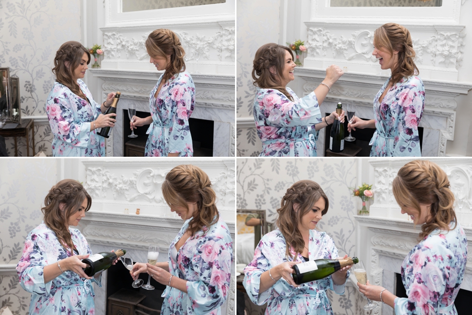 Bridesmaids opening the champagne whilst getting ready at Morden Hall Weddings